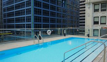 a swimming pool in front of a building